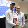 Novak Djokovic, Serbian Tennis Player, and Milos Rastovic, Cultural Outreach Coordinator of the SNF, with SNF Gifts